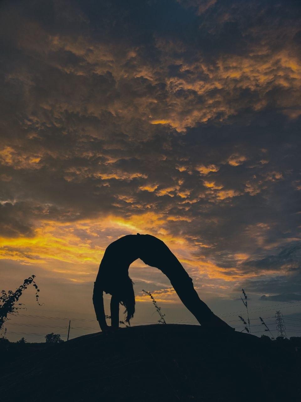 Sunset backbend silhouette